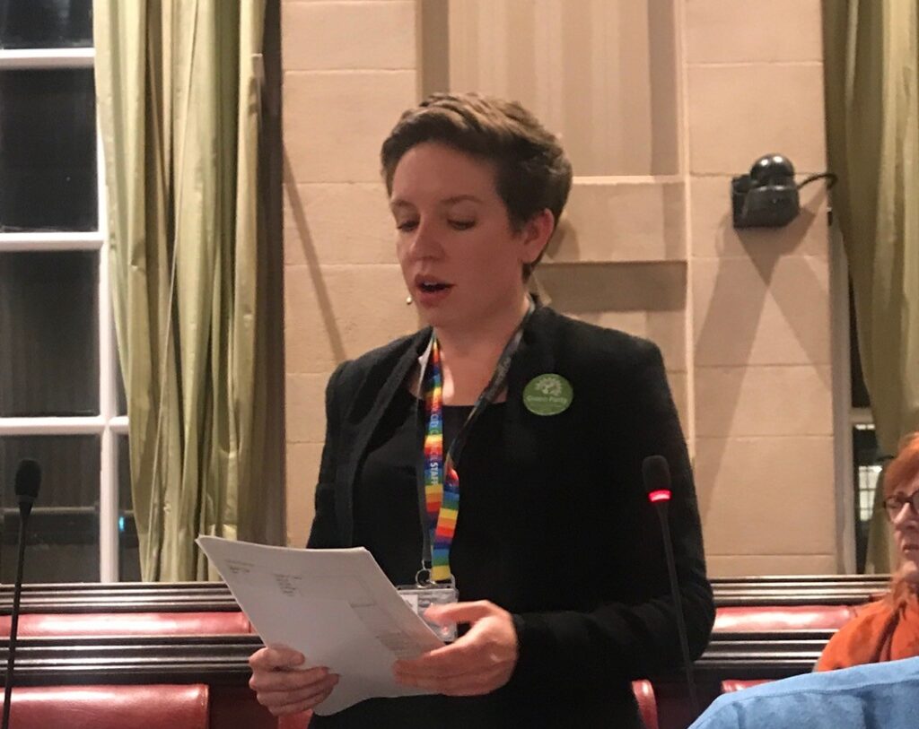 Carla giving a speech in Bristol City Hall chamber